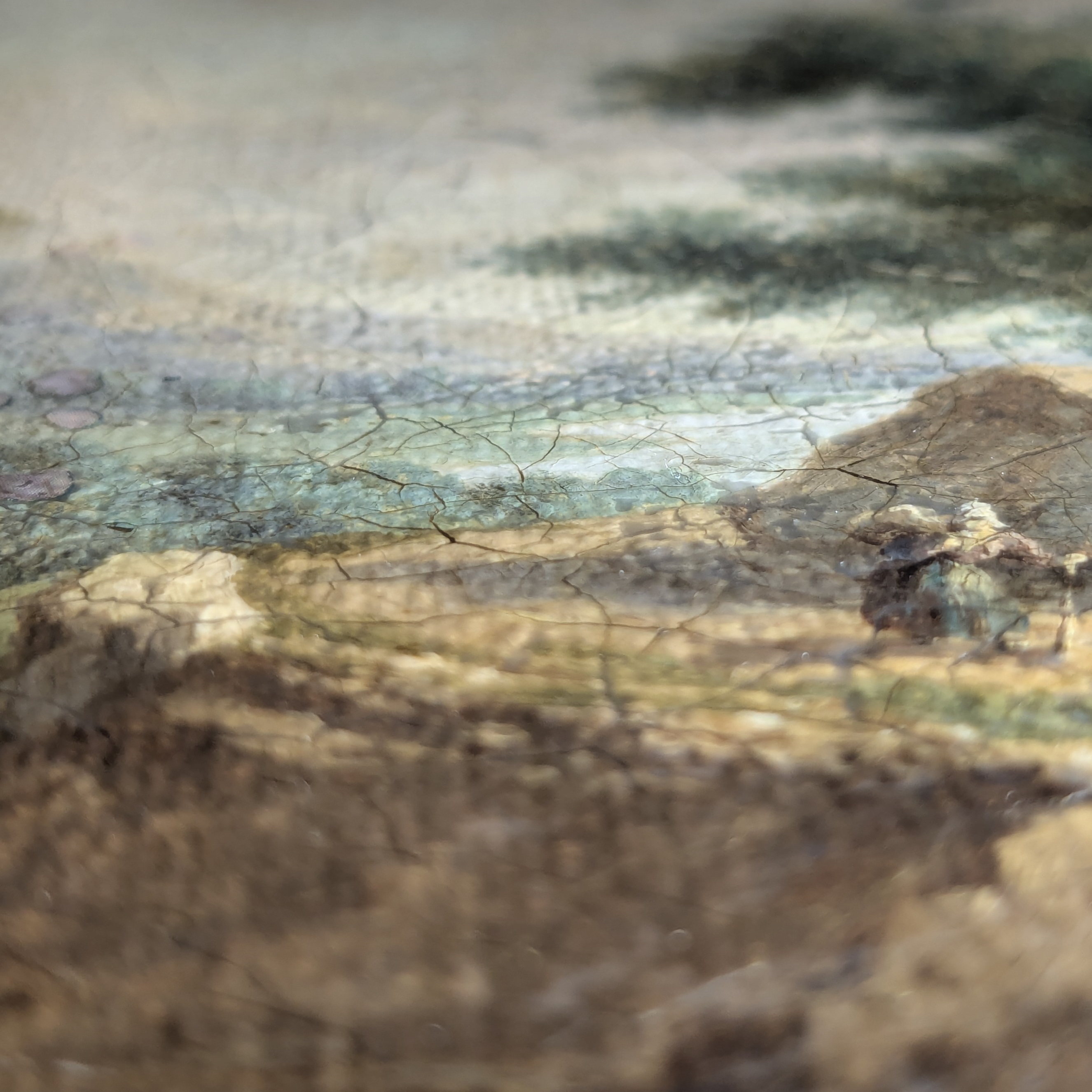 Macro detail of micro-thin mask conforming to canvas surface texture